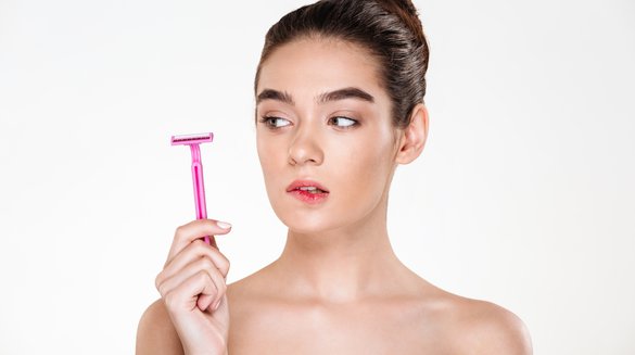 beauty-portrait-feminine-woman-with-soft-clean-skin-looking-pink-razor-her-hand-preparing-body-treatment.jpg