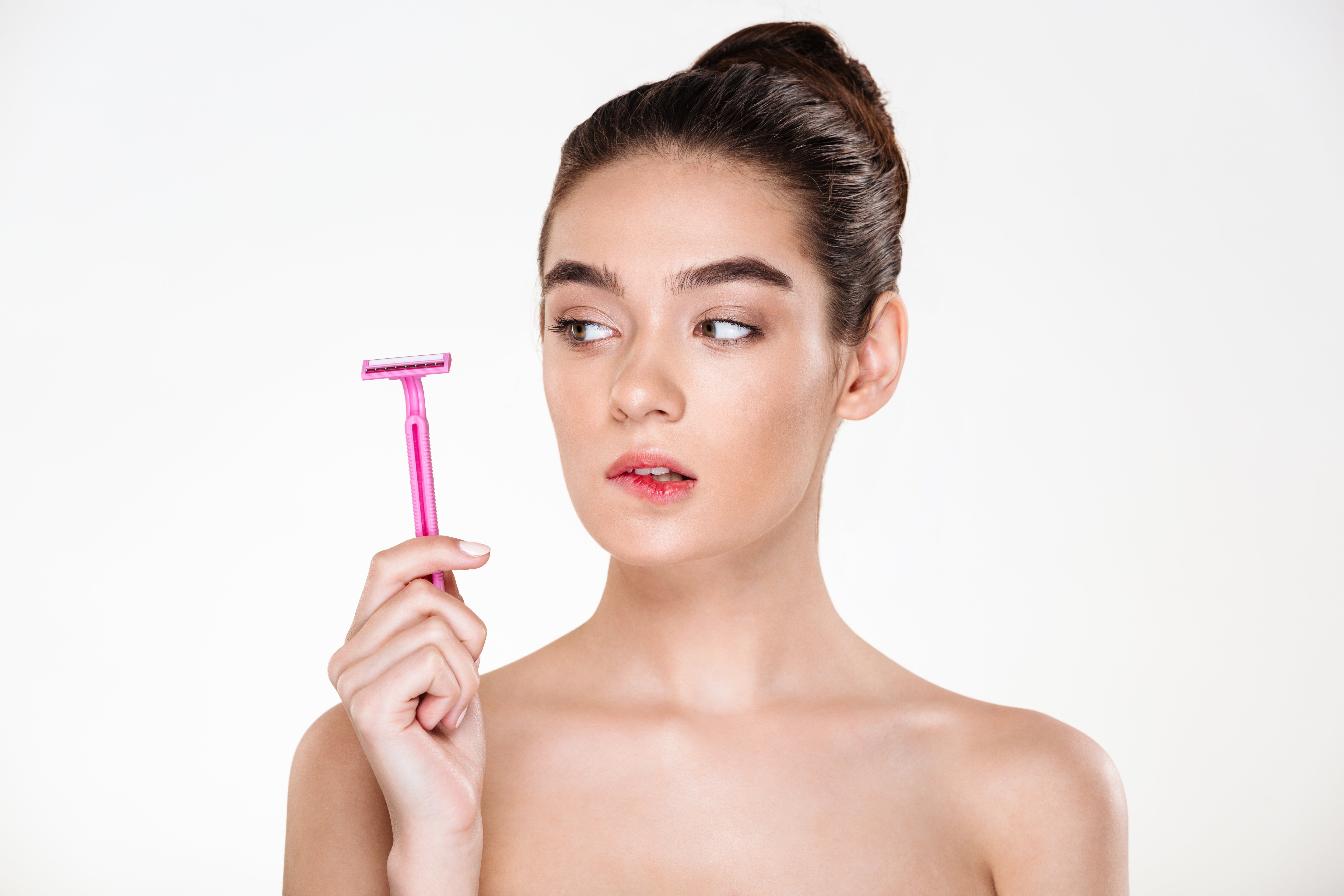 beauty-portrait-feminine-woman-with-soft-clean-skin-looking-pink-razor-her-hand-preparing-body-treatment.jpg