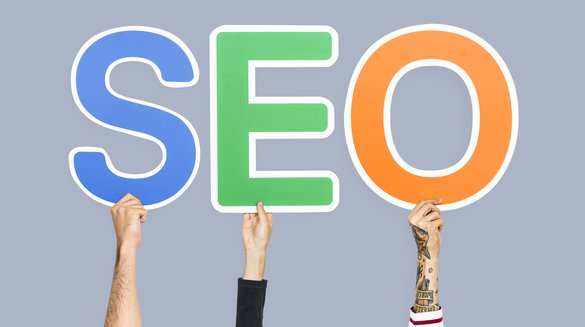 hands-holding-up-colorful-letters-forming-abbreviation-seo.jpg