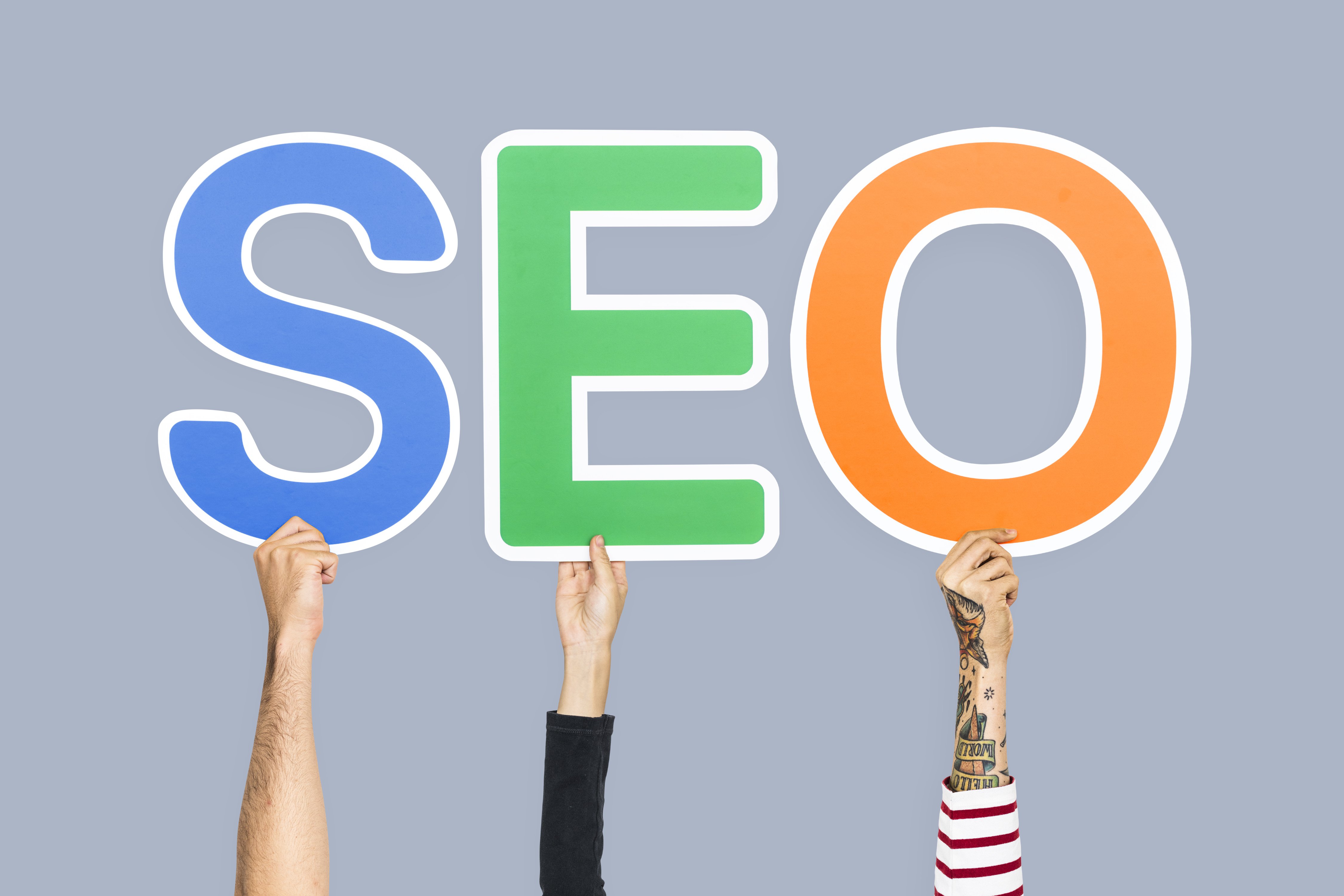hands-holding-up-colorful-letters-forming-abbreviation-seo.jpg