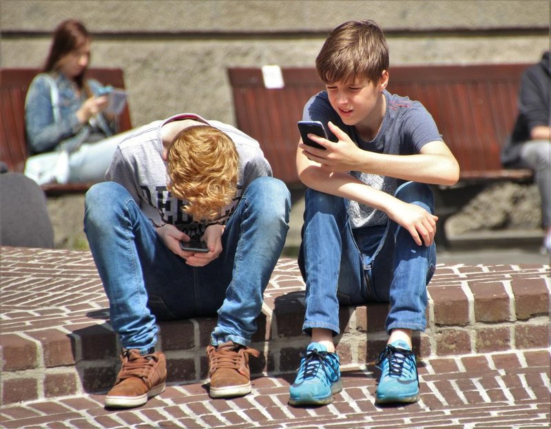 kids using mobole phone.jpg